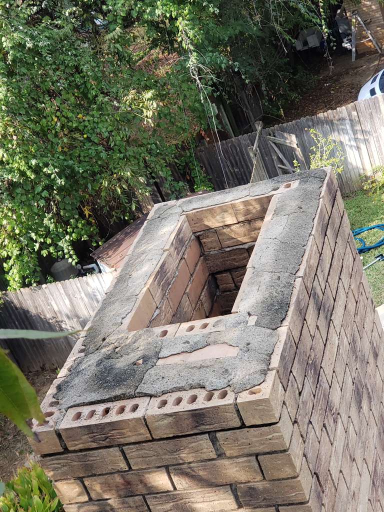 Damaged chimney top and deteriorated crown before repair